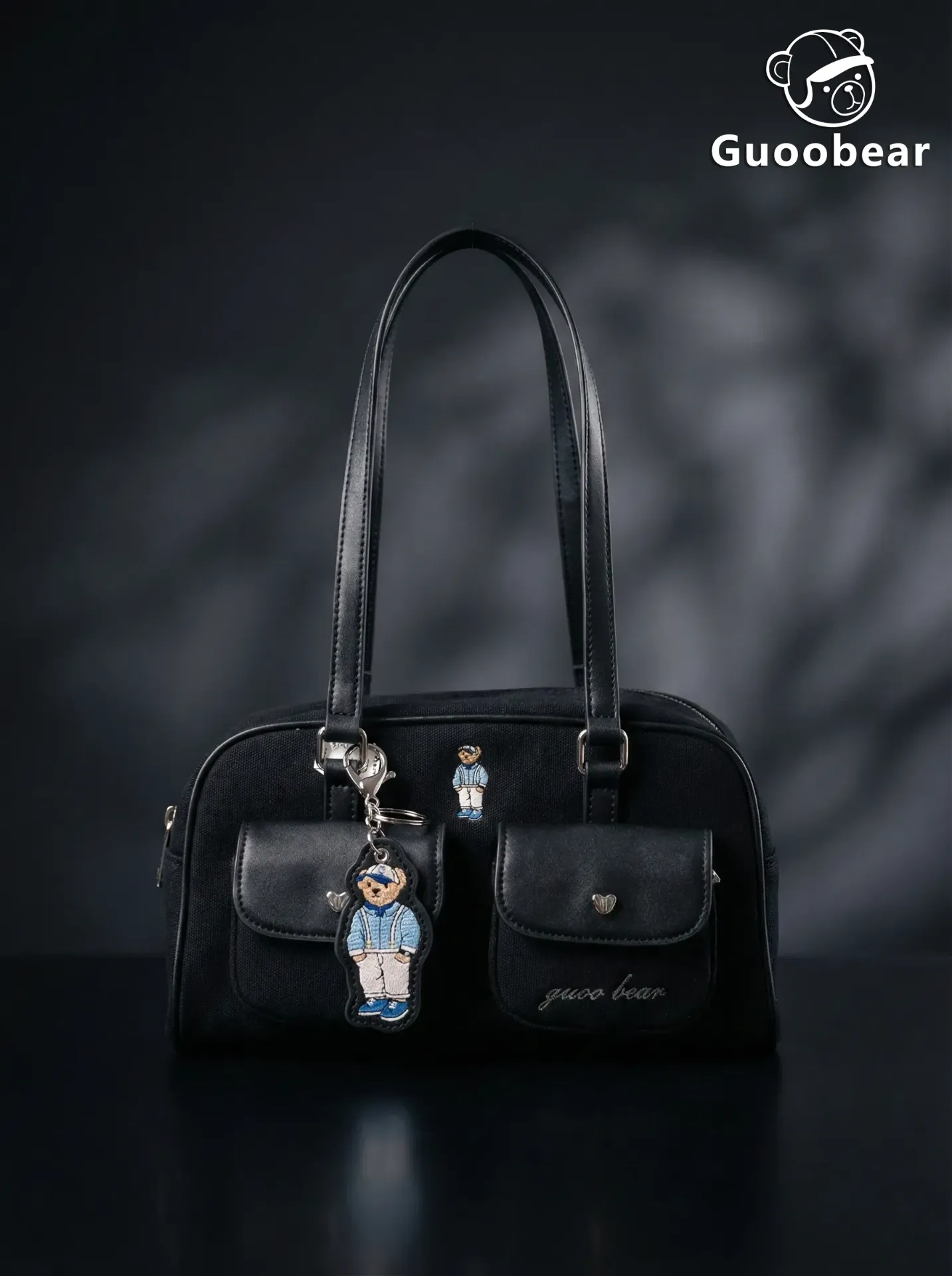 Black canvas embroidered shoulder bag